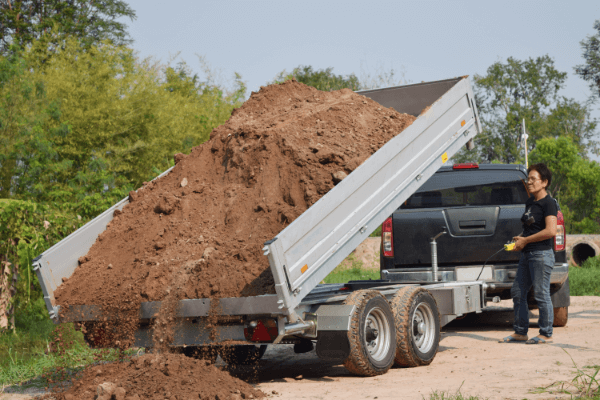 A truck dumping dirt