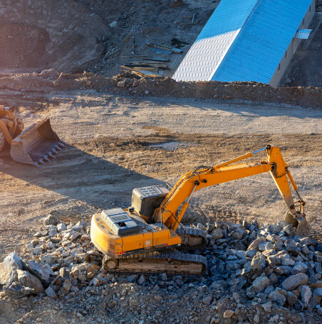 Excavator and bulldozer in construction site.