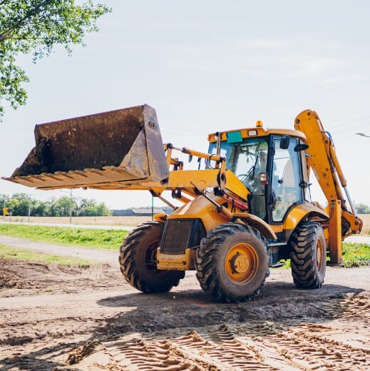 A yellow backhoe